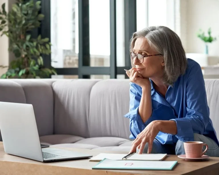 Woman at Work Thinking About FMLA Leave for Mental Health and Addiction Treatment